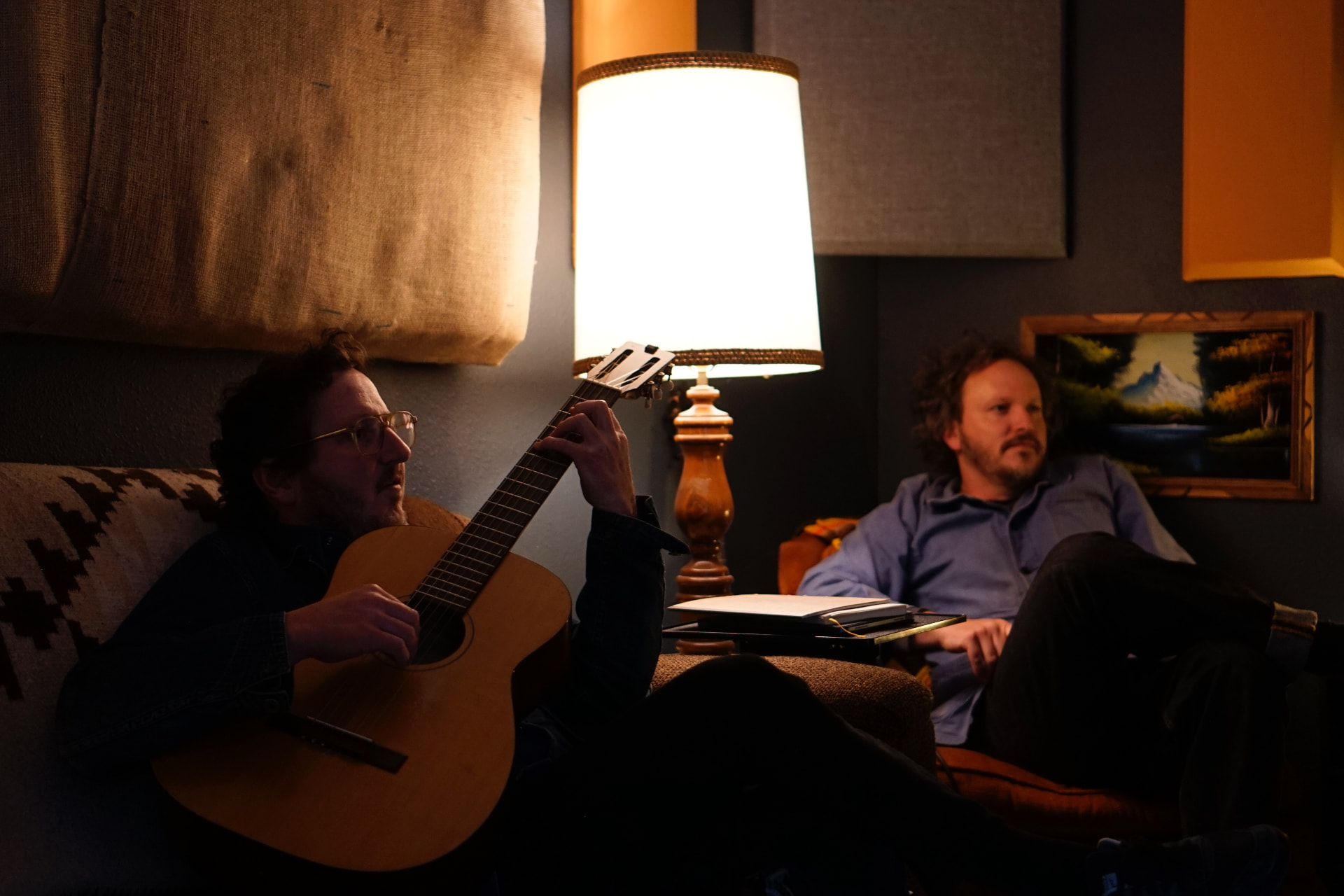 Puff Piece musicians writing together in the studio