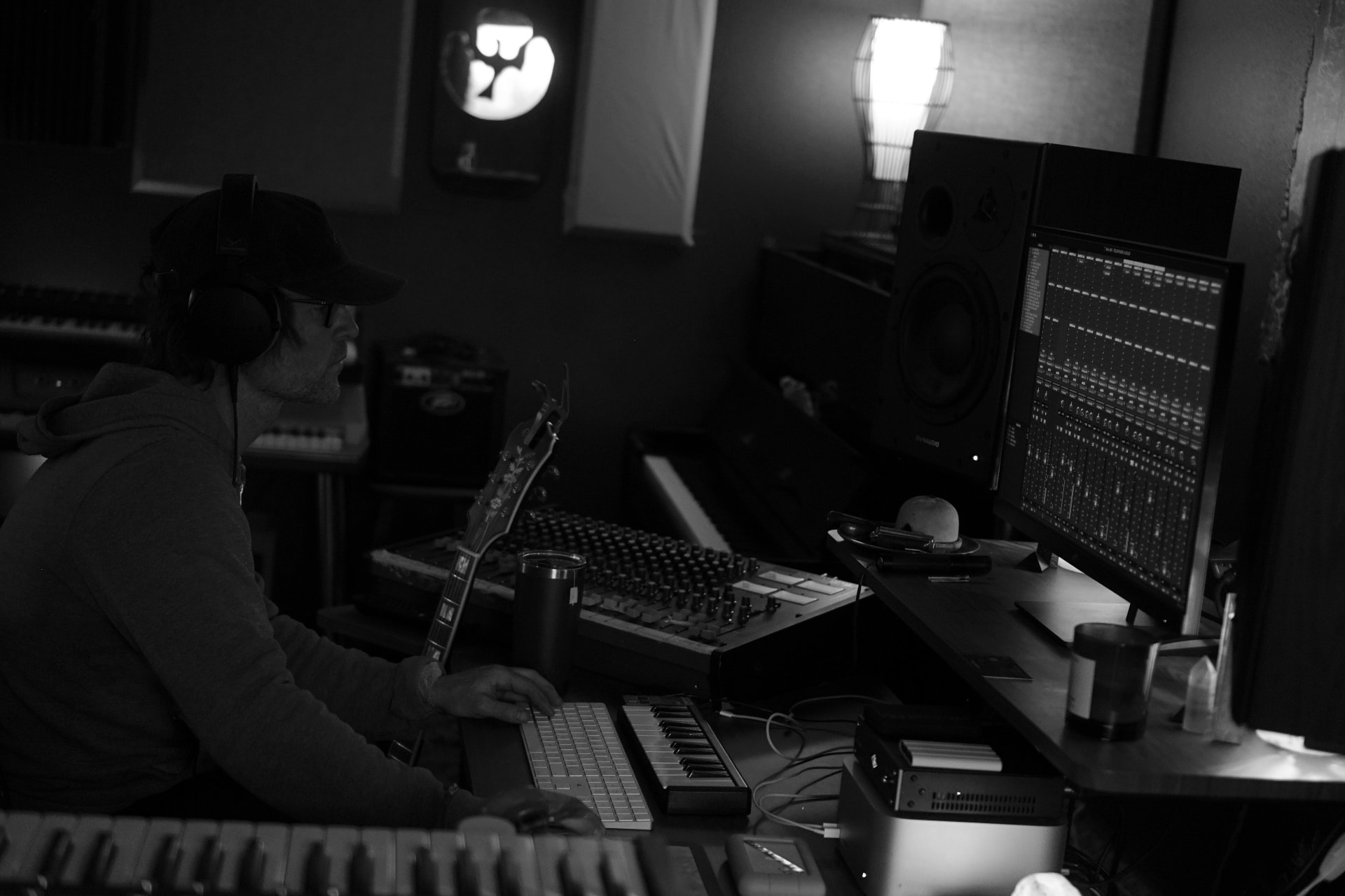 Puff Piece musician working at the studio console